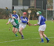 Irish women playing camogie