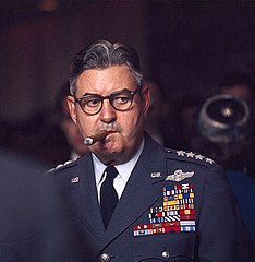 The fifth chief of staff, General Curtis Emerson LeMay smoking a cigar at a Senate committee hearing.