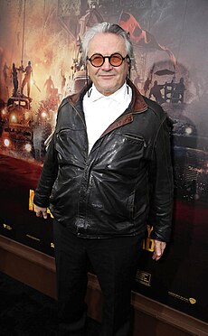 Director, co-writer, and co-producer George Miller (pictured in 2015) George Miller at Fury Road premiere.jpg