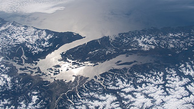 Sunlight reflects off the Salish Sea as seen from the ISS on April 11, 2020