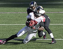 Smith facemasking Devin Hester in 2014 Jimmy Smith Devin Hester facemask Oct 19 2014.jpg
