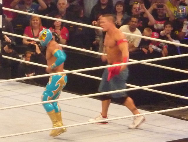 Sin Cara teaming with John Cena at the WWE Raw tapings on April 18, 2011, in London, England