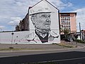 Mural in de stad De staalarbeider, van de hand van de graffiti-kunstenaar Hendrik Beikirch