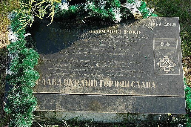 World War II-era monument in memory of UPA fighters with inscription "Glory to Ukraine! Glory to the heroes!", in place of the Janowa Dolina massacre,