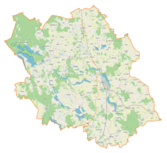 Mapa konturowa powiatu oleckiego, blisko centrum na prawo znajduje się punkt z opisem „Olecko”