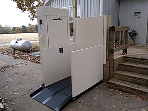 Residential Wheelchair Lift installed against raised deck.jpg