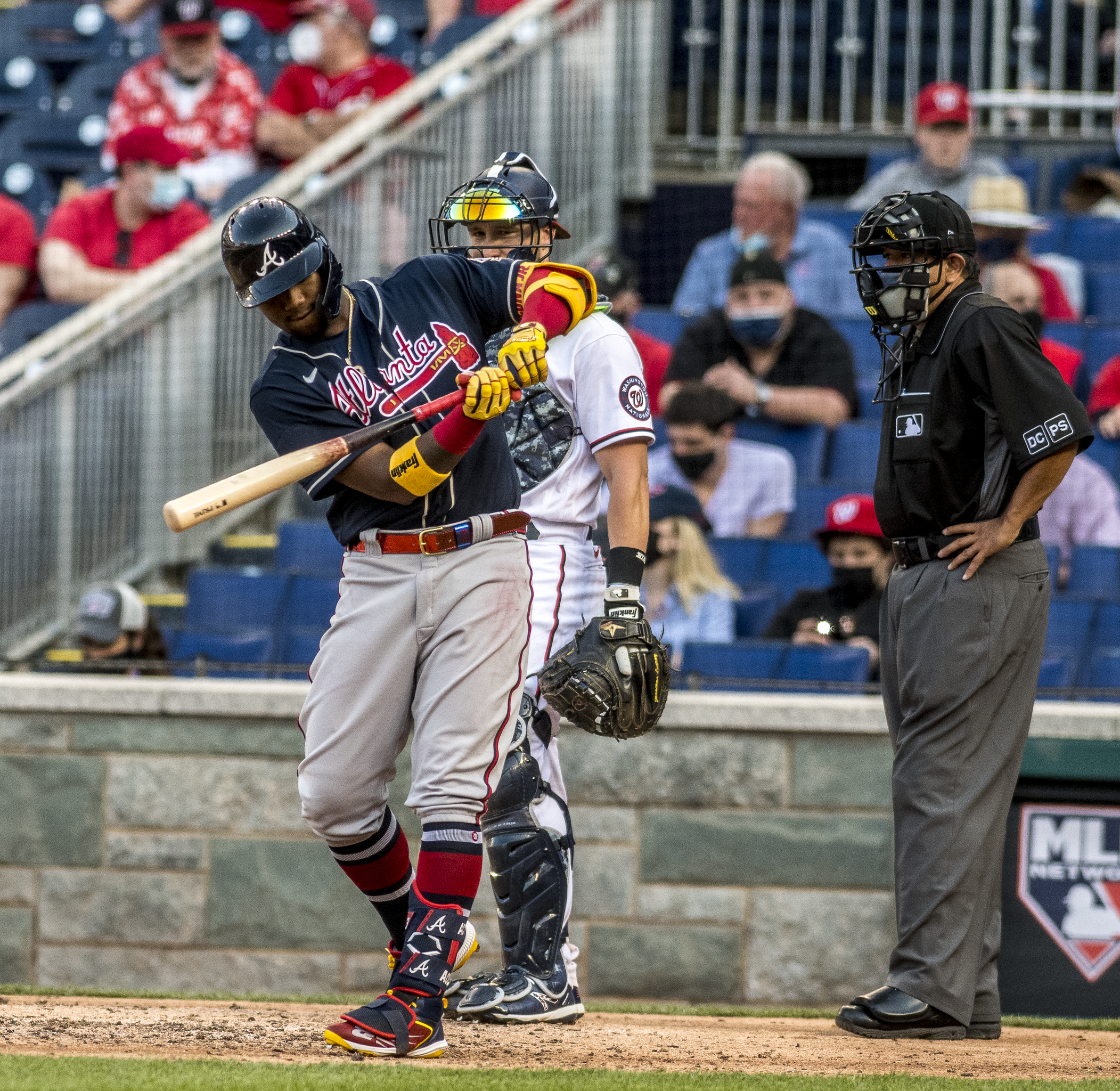 Ronald Acuña Jr. fends off fans on field during Braves-Rockies game