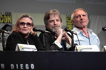 Fisher with Mark Hamill and Harrison Ford at the 2015 San Diego Comic-Con promoting Star Wars: The Force Awakens