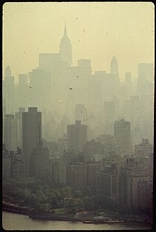 A 1973 photo of New York City skyscrapers in smog SKYSCRAPERS OF MANHATTAN VEILED IN SMOG - NARA - 548360.jpg