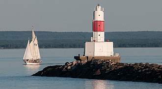 Schooner Coaster II passing the Presque Isle Harbor Breakwater Lighthouse Schooner Coaster II Passes the Presque Isle Harbor Breakwater Lighthouse.jpg