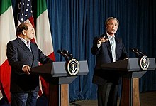 Silvio Berlusconi and George W. Bush, speaking at Crawford, Texas Silvio Berlusconi and George W. Bush, speaking at Crawford, Texas.jpg