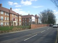 Left: flats built over the station site. Right: the bridge. Site of the former mill hill hale railway station 2009.JPG
