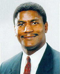 African American man with short hair and a short mustache