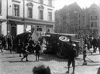 Partisans loyal to the Spartacist uprising set up barricades in Berlin Spartakisten-Barrikaden Ellerstr. DDorf.jpg