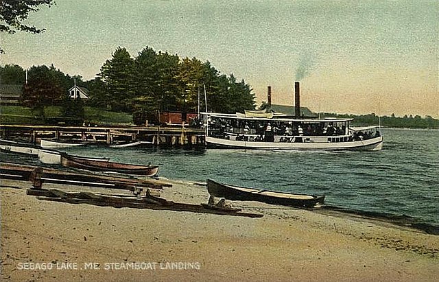 Steamboat landing at Sebago Lake Station in 1907 (note transfer of freight from boxcar to left of steamboat)