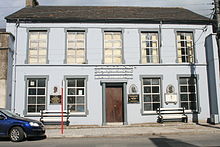 St Patrick's Parish Hall with three plaques commemorating people from Tallow