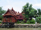 Traditional Thai-style stilt house on a canal near the Chao Phraya River in Bangkok