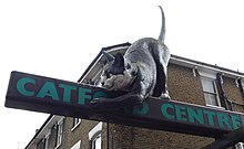 The Catford Cat - a statue in Catford town centre, depicting a giant cat clawing at the Catford Centre sign. The Catford Cat.jpg