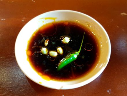 Toyomansi, a typical Filipino dipping sauce composed of soy sauce and calamansi spiced with siling labuyo