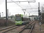 A tram approaching Therapia Lane tram stop, with the depot buildings in the background Tram and depot near Therapia Lane - geograph.org.uk - 1203717.jpg