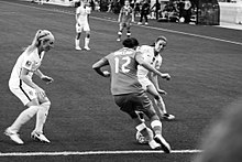 Sinclair takes on two defenders during a match against the United States, January 2017 United States v Canada (31223925634).jpg