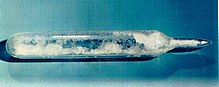 Snow-like substance in a sealed glass ampoule.