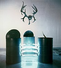 Vasiliy Ryabchenko, "Big Bembi", installation, barrels, linear lamps, deer horns, 1994.