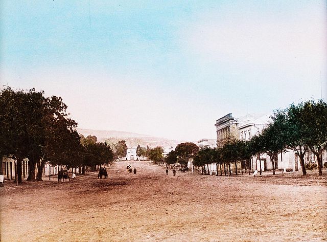 View of High Street looking west from the corner of Hill Street towards the Drostdy Arch, the main entrance to the present-day Rhodes University campu