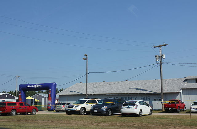 Cars parked by the entrance to the Vilas County Fairgrounds during the 2015 fair