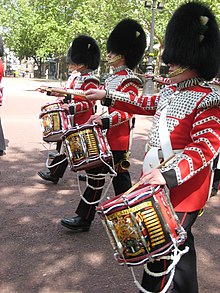 Three Drummers in the Corps of Drums of the Welsh Guards march up the Mall Welsh guards drummers on the mall.jpg