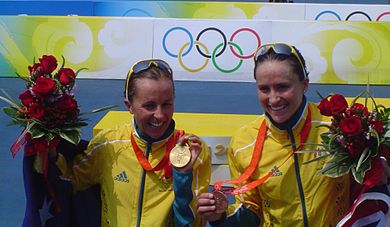 Emma Snowsill (left) and Emma Moffatt (right) from Australia show off their gold and bronze medals after the women's triathlon.