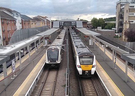 An Elizabeth line Class 345 (left) alongside a Thameslink Class 700 at Abbey Wood in 2022