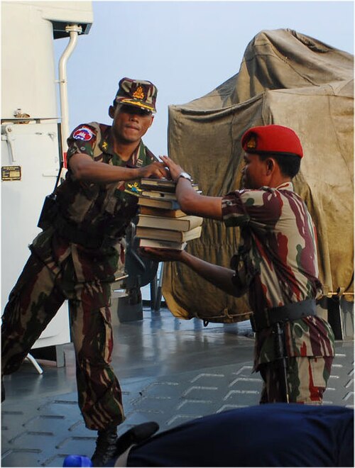 Member of the Cambodian 911 ParaCommando on USS Essex with a F-S commando dagger on his webbing belt.