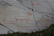 English: Rock art in the world heritage area in Alta, Norway. This is from the area Bergbukten 3a, a group of some 40 figures. 18-20 m above sea level, and 5000-6000 years old.