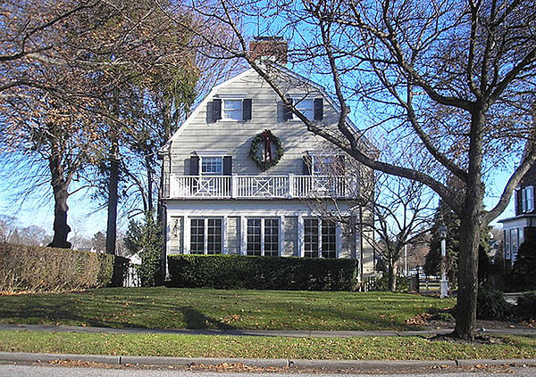 The Amityville Horror house in December 2005. The house's signature quarter moon windows on the top floor were replaced in 1990.