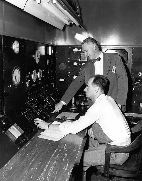Zinn (standing) presses the button that closes down the Chicago Pile-3 unit for good.