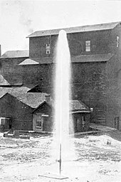 An artesian well at Belle Plaine, 1903 Artesian Well at Belle Plaine - History of Iowa.jpg