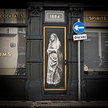 A mural by Hendog of Winchester's Indian Marchioness Bapsybanoo Pavry. A woman in a shawl and a long sari, looking out into the distance.