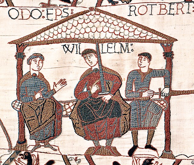 Image from the Bayeux Tapestry showing William with his half-brothers. William is in the centre, Odo is on the left with empty hands, and Robert is on