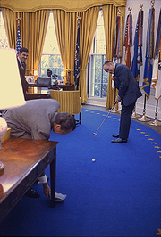 Hope, a golf fan, putting a golf ball into an ashtray held by President Richard Nixon in the Oval Office in 1973 Bob Hope playing golf in the Oval Office.png