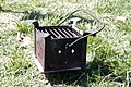 Simple box-style brazier, with broad grill, intended as a metal container (e.g. kettle/tray) heater/cooker