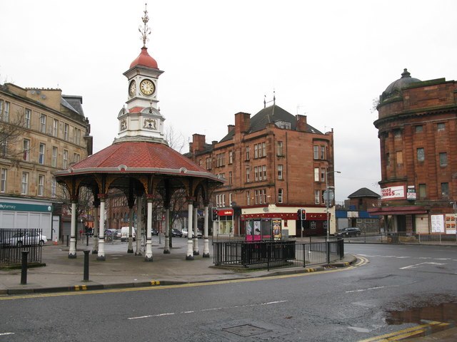Bridgeton Cross with the "Brigton Umbrella" [de], former station building (background centre) and Olympia theatre (right) prior to renovation work.
