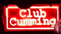 Neon sign with Club Cumming logo