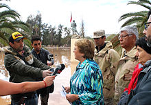 President Michelle Bachelet visiting the affected area Declaracion a la prensa en regimiento Copiapo (16731949427).jpg