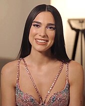 English singer Dua Lipa's song "Levitating" spent 14 non-consecutive weeks at number one. Dua Lipa with Warner Music.jpg