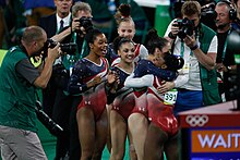 Douglas celebrating with the other Final Five members at the 2016 Olympic Games EUA levam ouro na ginastica artistica feminina; Brasil fica em 8o lugar (28879957845).jpg