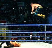 Eddie Guerrero performs a frog splash on Danny Basham. Eddie Guerrero Frog Splash cropped.jpg