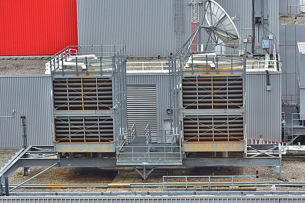 A typical evaporative, forced draft open-loop cooling tower rejecting heat from the condenser water loop of an industrial chiller unit