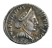 Denarius from the time of Augustus, in silver, minted under the monetary magistrate Petronius Turpillianus. On the right, the bust in profile of the goddess Feronia crowned with a diadem, dressed in a drape, a necklace around her neck. Legend: TURPILLIANUS III VIR FE RON ("Turpillianus being a monetary triumvir magistrate, in Feronia") Feronia.jpg