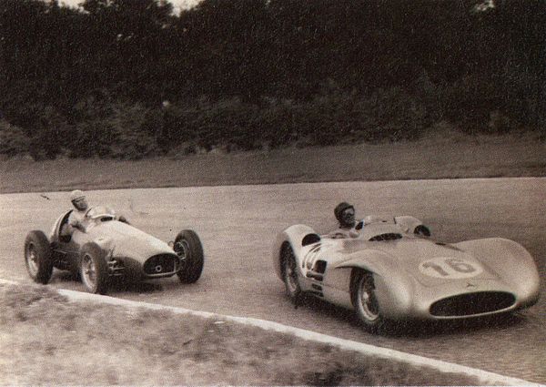 Juan Manuel Fangio (Mercedes-Benz W196) leads Alberto Ascari (Ferrari 625) in the 1954 Italian Grand Prix at Monza.